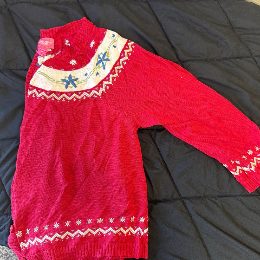 Woman Within Red Sweater with Snowflake Accents